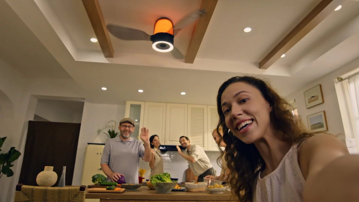Ceiling fan with an integrated speaker system and built-in lighting in a modern kitchen.